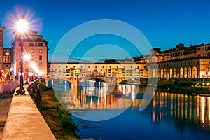 Fantastic evening cityscape of Florence with Old Palace Palazzo Vecchio or Palazzo della Signoria on background and Ponte