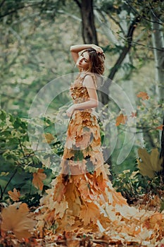 Fantastic girl in the autumn forest.