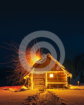 Fantastic landscape with glowing snowy house