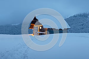 Fantastic landscape with snowy house