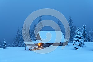 Fantastic landscape with snowy house