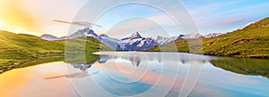 Fantastic landscape at sunrise over the lake in the Swiss Alps,