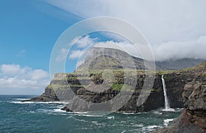 Fantastic landscape with waterfall Mulafossur on the Vagar Island of the Faroe Islands.