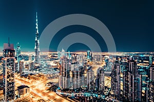 Fantastic nighttime Dubai skyline with illuminated skyscrapers