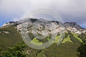 Fantastic  panorama of Banff. Nature landscape - snowy peaks mountains, clear lakes and forests. Tourism Alberta, Canada