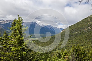 Fantastic  panorama of Banff. Nature landscape - snowy peaks mountains, clear lakes and forests. Tourism Alberta, Canada