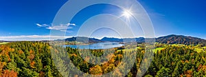 Fantastic panoramic view over the bavarian lake Tegernsee in autumn with fall colors, made by a drone.