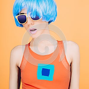 Fantastic party fashion lady in blue wig and glasses