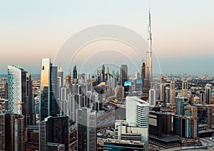 Fantastic rooftop view of Dubai business bay towers at sunset.