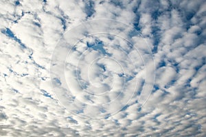 Fantastic soft white clouds against blue sky