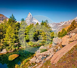 Fantastic summer morning on Grindjisee lake. Great view of  Matterhorn Monte Cervino, Mont Cervin peak