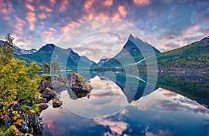 Fantastic summer sunrise on the Innerdalsvatna lake. Colorful morning scene in Norway, Europe. Beauty of nature concept background