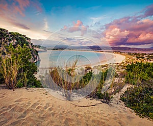 Fantastic summer sunset on Voidokilia beach. Colorful evening seascape of Ionian Sea