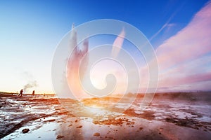 Fantastic sunset Strokkur geyser eruption in Iceland.