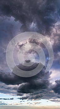 Fantastic thunderclouds, vertical panorama