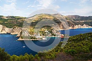 Fantastic top view at Asos village, Assos peninsula and blue Ionian Sea water. Aerial view, summer scenery of famous and