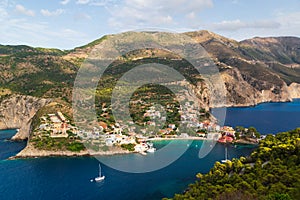 Fantastic top view at Asos village, Assos peninsula and blue Ionian Sea water. Aerial view, summer scenery of famous and