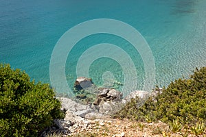 Fantastic turquoise crystal clear water, sand and pebbles of the Agia Kyriaki beach in the Kiparissi Lakonia village, Peloponnese