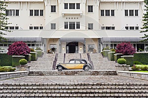 Fantastic view in front of a luxury hotel with a vintage car