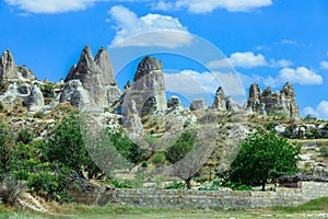 Fantastic View to the GÃ¶reme with rock houses in front of the spectacularly coloured valleys nearby,