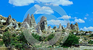 Fantastic View to the GÃ¶reme with rock houses in front of the spectacularly coloured valleys nearby,