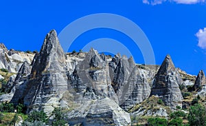 Fantastic View to the GÃ¶reme with rock houses in front of the spectacularly coloured valleys nearby,