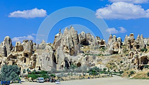 Fantastic View to the GÃ¶reme with rock houses in front of the spectacularly coloured valleys nearby,