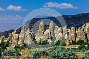 Fantastic View to the GÃ¶reme with rock houses in front of the spectacularly coloured valleys nearby,