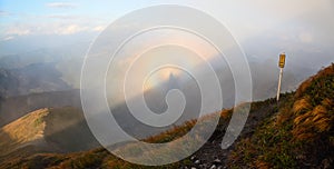 Fantastic views of the mountains and the colorful phenomenon Brocken Spectre.