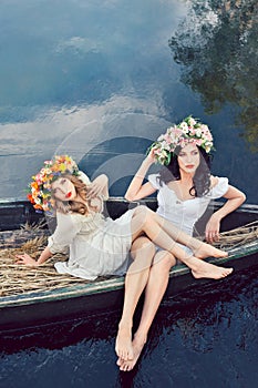 Fantasy art photo of a beautiful girls in boat