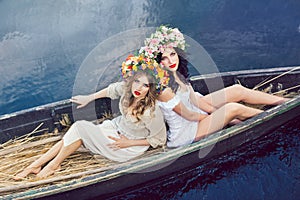 Fantasy art photo of a beautiful girls in boat