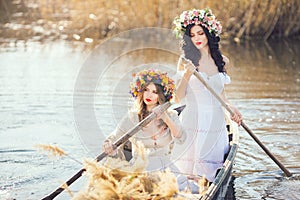 Fantasy art photo of a beautiful girls in boat