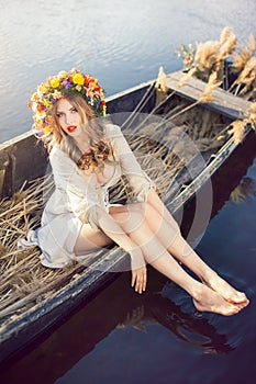 Fantasy art photo of a beautiful lady in boat