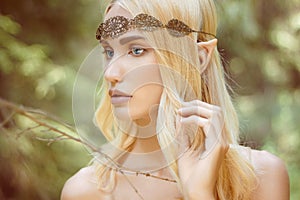 Fantasy beautiful elf girl in woods