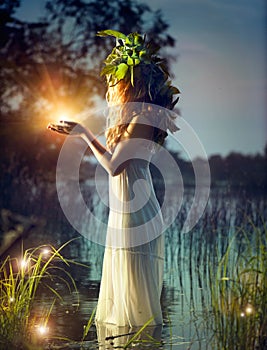 Fantasy girl taking magic light