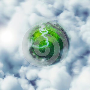 Fantasy green little planet in the sky immerged in clouds