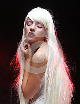 Fantasy Halloween Vampire woman portrait. Beauty Sexy Vampire with long white hair.