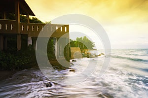 Fantasy image of beach with sunlight effect, soft wave hitting the shore