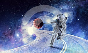 Fantasy image with spaceman catch planet. Mixed media