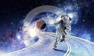 Fantasy image with spaceman catch planet. Mixed media