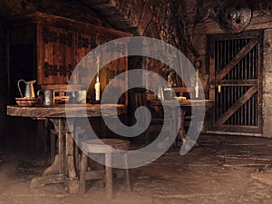Fantasy interior of a medieval tavern with wooden tables and candles