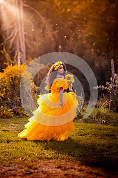 Fantasy magic fairy nymph in yellow dress