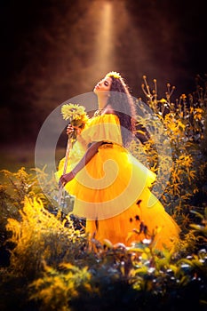 Fantasy magic fairy nymph in yellow dress