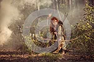 Fantasy medieval woman hunting in mystery forest