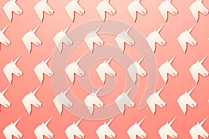 Fantasy Ñoncept. Artwork. Trendy pattern made with Unicorns on bright light coral background