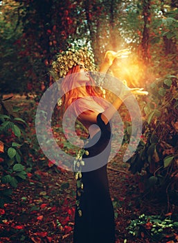 Fantasy photo of young redhair lady wizard photo