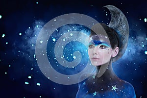 Fantasy portrait of moon woman with stars make-up and moon style hairdo photo