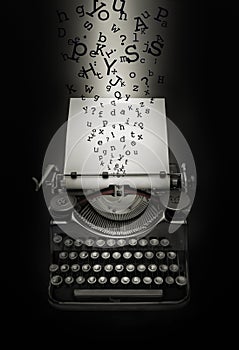 Fantasy recreation of letters falling down on typewriter