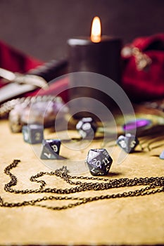 Fantasy role play board game still life concept. Selective focus on dice.