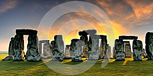 Fantasy sunset at Stonehenge with dramatic red sky.